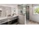 Elegant bathroom with a marble countertop, a large mirror, and a glass walk-in shower at 4520 Garmon Nw Rd, Atlanta, GA 30327