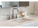 Bathroom featuring a marble countertop with a modern chrome faucet and decorative soap dispensers at 4520 Garmon Nw Rd, Atlanta, GA 30327