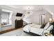 Stylish bedroom with a cozy window seat, a TV, and chic modern lighting at 4520 Garmon Nw Rd, Atlanta, GA 30327