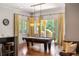 Billiard room with pool table, stylish lighting, and large windows overlooking the outdoor space at 4520 Garmon Nw Rd, Atlanta, GA 30327