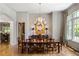Elegant dining room boasts hardwood floors and a stunning chandelier above a large wooden table at 4520 Garmon Nw Rd, Atlanta, GA 30327