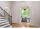 Entryway view of an office space featuring built-in shelves, desk, and a comfortable chair at 4520 Garmon Nw Rd, Atlanta, GA 30327