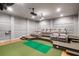 Amazing home theater with tiered seating, projector system, and golf simulator at 4520 Garmon Nw Rd, Atlanta, GA 30327