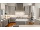 Grey kitchen with stainless steel appliances, double ovens, pot filler, large island, and marble countertops at 4520 Garmon Nw Rd, Atlanta, GA 30327