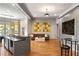 Open-concept living room featuring hardwood floors, comfortable seating, and large windows for natural light at 4520 Garmon Nw Rd, Atlanta, GA 30327