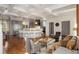 Open-concept living space featuring a spacious kitchen, living room furniture, and hardwood floors at 4520 Garmon Nw Rd, Atlanta, GA 30327