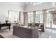 Elegant living room with high ceilings, fireplace, neutral furniture, and natural light at 4520 Garmon Nw Rd, Atlanta, GA 30327