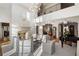 Grand living room with soaring ceilings, stone fireplace, neutral furniture, and ample natural light at 4520 Garmon Nw Rd, Atlanta, GA 30327