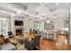 Spacious living room with fireplace, coffered ceilings, and an open layout to the kitchen at 4520 Garmon Nw Rd, Atlanta, GA 30327