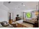 Spacious main bedroom with a four-poster bed, sitting area, and access to a private balcony at 4520 Garmon Nw Rd, Atlanta, GA 30327