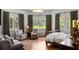 Spacious main bedroom with hardwood floors, natural light, and sitting area at 4520 Garmon Nw Rd, Atlanta, GA 30327