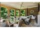 A covered patio with an outdoor kitchen, fireplace, and comfortable seating area is ready for entertaining at 4520 Garmon Nw Rd, Atlanta, GA 30327