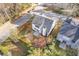 Charming home with a fenced backyard and mature trees, captured from an aerial perspective at 1074 Wenham Ln, Lawrenceville, GA 30044