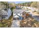 Aerial view of home with two-car garage and well-manicured lawn at 1074 Wenham Ln, Lawrenceville, GA 30044