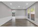 Dining room featuring hardwood floors, chair rail, and large windows for ample natural light at 1074 Wenham Ln, Lawrenceville, GA 30044