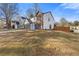 Two-story home with a two-car garage, a well-manicured lawn, and a bright blue front door at 1074 Wenham Ln, Lawrenceville, GA 30044