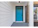 Close-up of a bright blue front door with white trim and sidelight on a two-story home at 1074 Wenham Ln, Lawrenceville, GA 30044