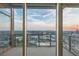 Stunning balcony view with city skyline visible through large glass sliding doors at 3630 Peachtree Ne Rd # 3302, Atlanta, GA 30326