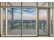 Breathtaking balcony view with city skyline and blue skies through sliding glass doors at 3630 Peachtree Ne Rd # 3302, Atlanta, GA 30326