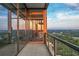 Modern balcony with glass railings offering panoramic views of the cityscape at 3630 Peachtree Ne Rd # 3302, Atlanta, GA 30326