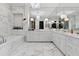 Upscale bathroom featuring marble finishes, dual vanities, and stylish lighting at 3630 Peachtree Ne Rd # 3302, Atlanta, GA 30326