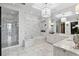 Elegant bathroom with marble accents, a soaking tub, and a glass-enclosed shower at 3630 Peachtree Ne Rd # 3302, Atlanta, GA 30326