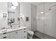 Bright white bathroom featuring a glass shower, stylish vanity, and modern fixtures at 3630 Peachtree Ne Rd # 3302, Atlanta, GA 30326