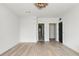 Bright, airy bedroom featuring hardwood floors and a modern light fixture at 3630 Peachtree Ne Rd # 3302, Atlanta, GA 30326