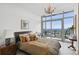 Bedroom featuring a large window with city views, desk and warm decor at 3630 Peachtree Ne Rd # 3302, Atlanta, GA 30326