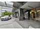 Elegant building entrance with a porte-cochere, landscaping, and a clear signage at 3630 Peachtree Ne Rd # 3302, Atlanta, GA 30326