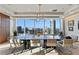 Conference room with natural light, modern chandelier, large marble table, and city views at 3630 Peachtree Ne Rd # 3302, Atlanta, GA 30326