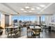 Bright dining area featuring multiple tables, chairs, and floor-to-ceiling windows with city views at 3630 Peachtree Ne Rd # 3302, Atlanta, GA 30326