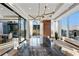 Spacious dining room with floor to ceiling windows, modern chandelier, and marble table at 3630 Peachtree Ne Rd # 3302, Atlanta, GA 30326