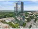 Stunning high-rise condo building with glass facade, lush landscaping, and a desirable urban location at 3630 Peachtree Ne Rd # 3302, Atlanta, GA 30326