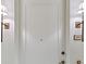View of a neutral front door with sconces and the number 3302 to the side at 3630 Peachtree Ne Rd # 3302, Atlanta, GA 30326