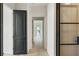Long hallway featuring wood floors, black doors, and natural light at 3630 Peachtree Ne Rd # 3302, Atlanta, GA 30326