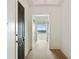 Bright hallway featuring light hardwood floors and views from the window at the end at 3630 Peachtree Ne Rd # 3302, Atlanta, GA 30326