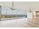 Bright living room with herringbone floors, modern lighting and expansive windows with scenic views at 3630 Peachtree Ne Rd # 3302, Atlanta, GA 30326