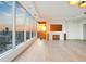 Living space with city views and sunset through floor to ceiling windows, plus a fireplace at 3630 Peachtree Ne Rd # 3302, Atlanta, GA 30326