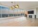 Modern living room featuring floor-to-ceiling windows with stunning city views and fireplace at 3630 Peachtree Ne Rd # 3302, Atlanta, GA 30326