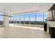 Bright living room featuring floor-to-ceiling windows with city views and hardwood floors at 3630 Peachtree Ne Rd # 3302, Atlanta, GA 30326