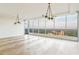 Spacious living area with herringbone wood floors, modern lighting and breathtaking panoramic views at 3630 Peachtree Ne Rd # 3302, Atlanta, GA 30326
