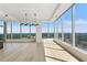 Bright living room featuring floor-to-ceiling windows offering city views and hardwood floors at 3630 Peachtree Ne Rd # 3302, Atlanta, GA 30326