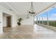 Elegant living room featuring herringbone floors, contemporary lighting, and floor-to-ceiling windows at 3630 Peachtree Ne Rd # 3302, Atlanta, GA 30326