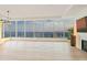 Bright living room with floor-to-ceiling windows boasting city views and hardwood floors at 3630 Peachtree Ne Rd # 3302, Atlanta, GA 30326