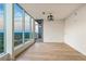 Spacious living room with hardwood floors and floor-to-ceiling windows offering panoramic views at 3630 Peachtree Ne Rd # 3302, Atlanta, GA 30326