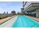 Outdoor pool area with lounge chairs and city skyline views from a high-rise residence at 3630 Peachtree Ne Rd # 3302, Atlanta, GA 30326