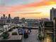 Stunning rooftop patio with comfortable seating and breathtaking city views at sunset at 3630 Peachtree Ne Rd # 3302, Atlanta, GA 30326