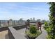 Outdoor rooftop space with comfortable seating, lush plants, and stunning city views at 3630 Peachtree Ne Rd # 3302, Atlanta, GA 30326