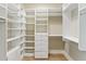 Bright walk-in closet with extensive custom shelving, drawers and hanging rods at 3630 Peachtree Ne Rd # 3302, Atlanta, GA 30326